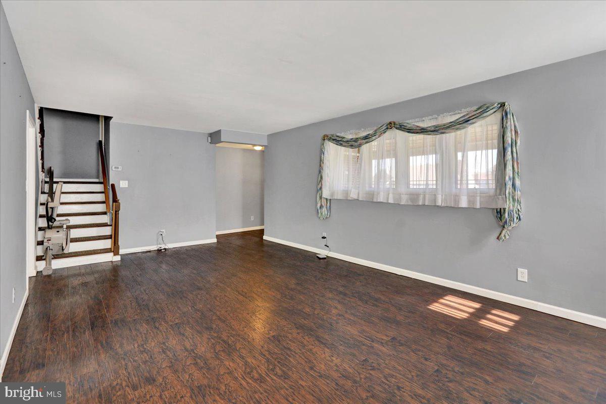 212 Mayer Street Reading, PA 19606 - Photo 10 of 37 a view of empty room with wooden floor and fan