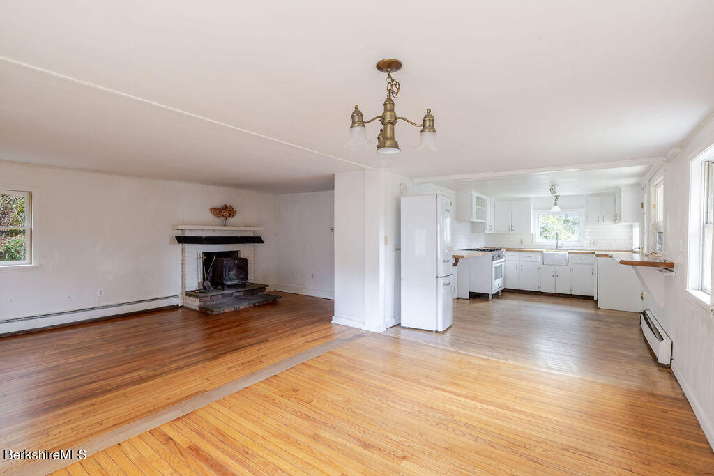 26 Lenox Road West Stockbridge, MA 01266 - Photo 12 of 40 a view of a livingroom with a furniture wooden floor and windows