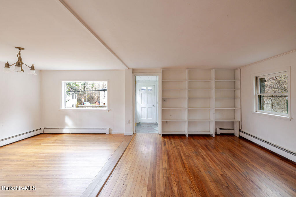 26 Lenox Road West Stockbridge, MA 01266 - Photo 14 of 40 an empty room with wooden floor closet and windows