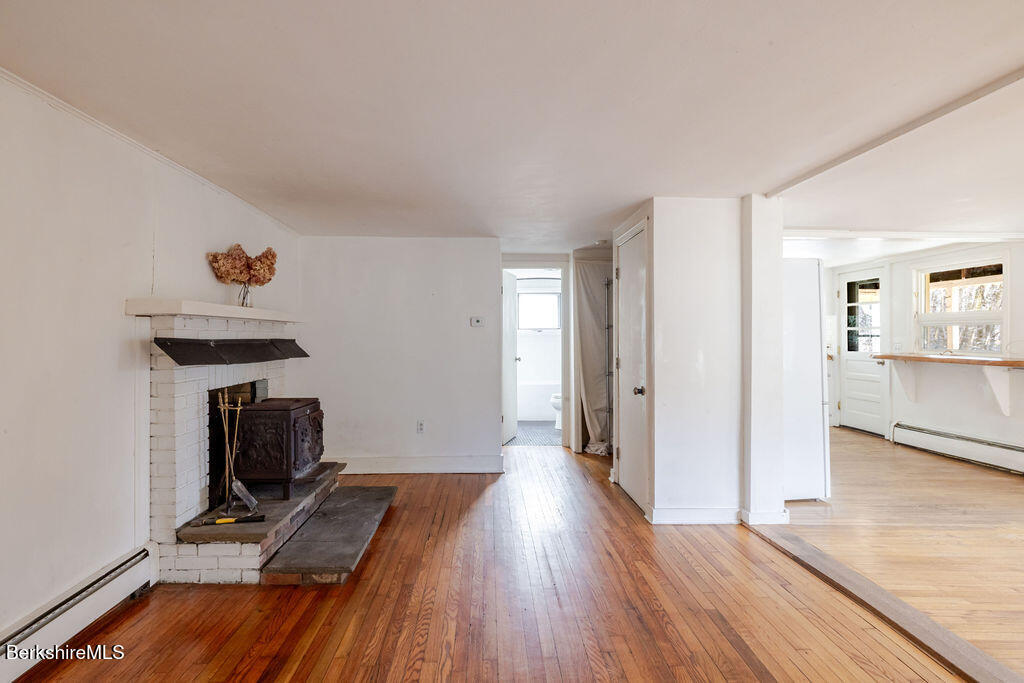 26 Lenox Road West Stockbridge, MA 01266 - Photo 16 of 40 a view of a livingroom with wooden floor and furniture