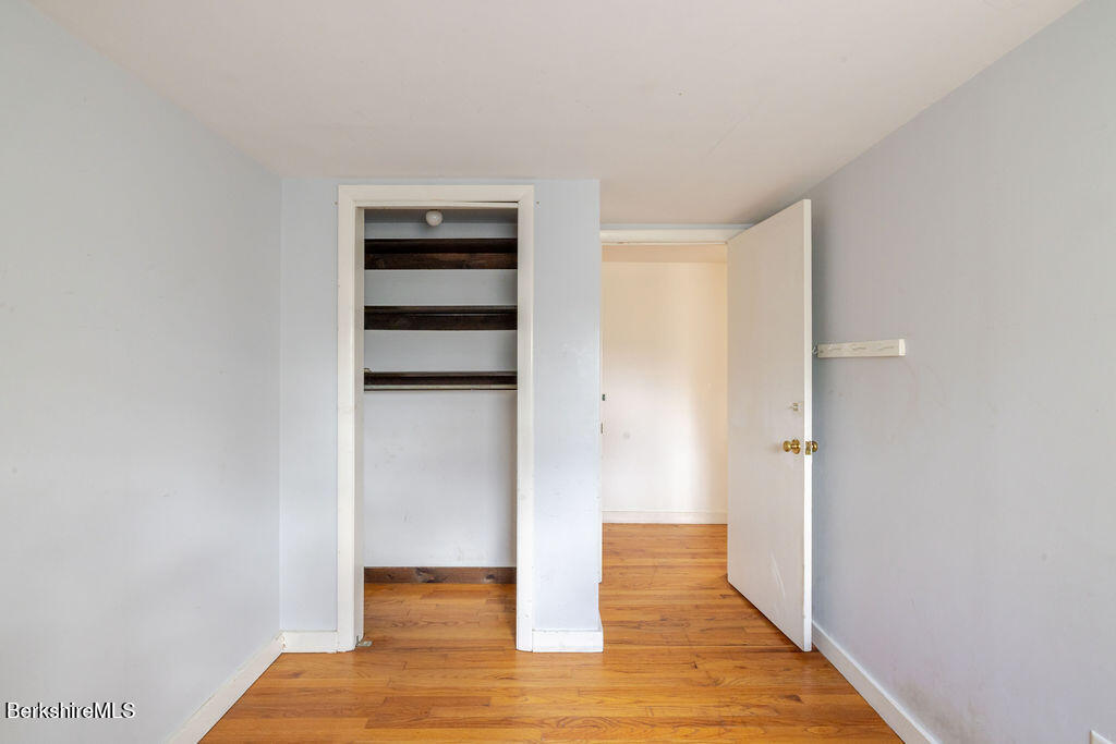 26 Lenox Road West Stockbridge, MA 01266 - Photo 20 of 40 a view of empty room with wooden floor