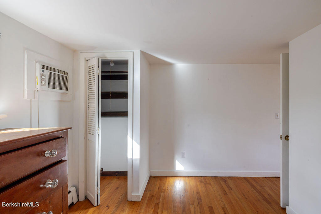 26 Lenox Road West Stockbridge, MA 01266 - Photo 21 of 40 an empty room with wooden floor closet and windows
