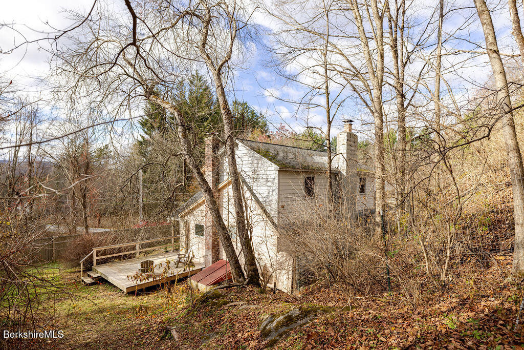 26 Lenox Road West Stockbridge, MA 01266 - Photo 28 of 40 a backyard of a house with lots of green space