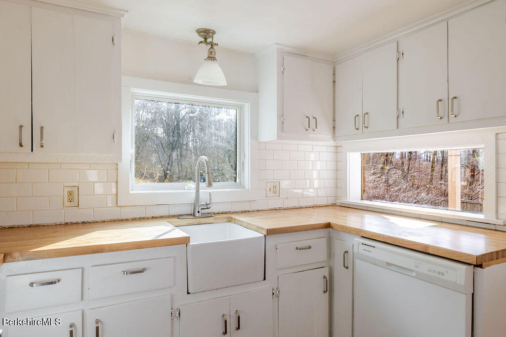 26 Lenox Road West Stockbridge, MA 01266 - Photo 10 of 40 a kitchen with granite countertop a sink window and cabinets