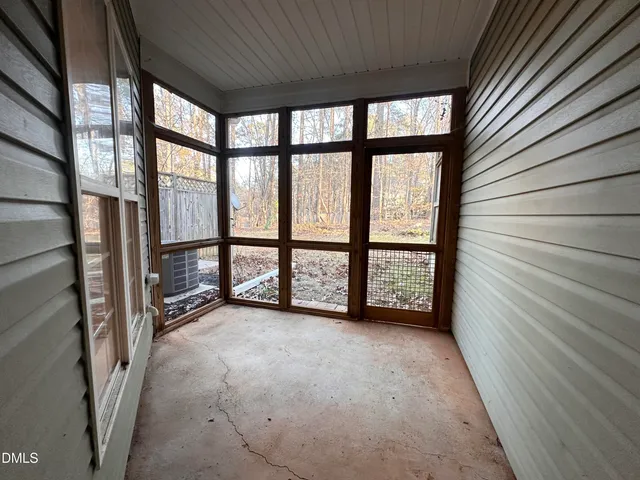 a view of an empty room with a large window