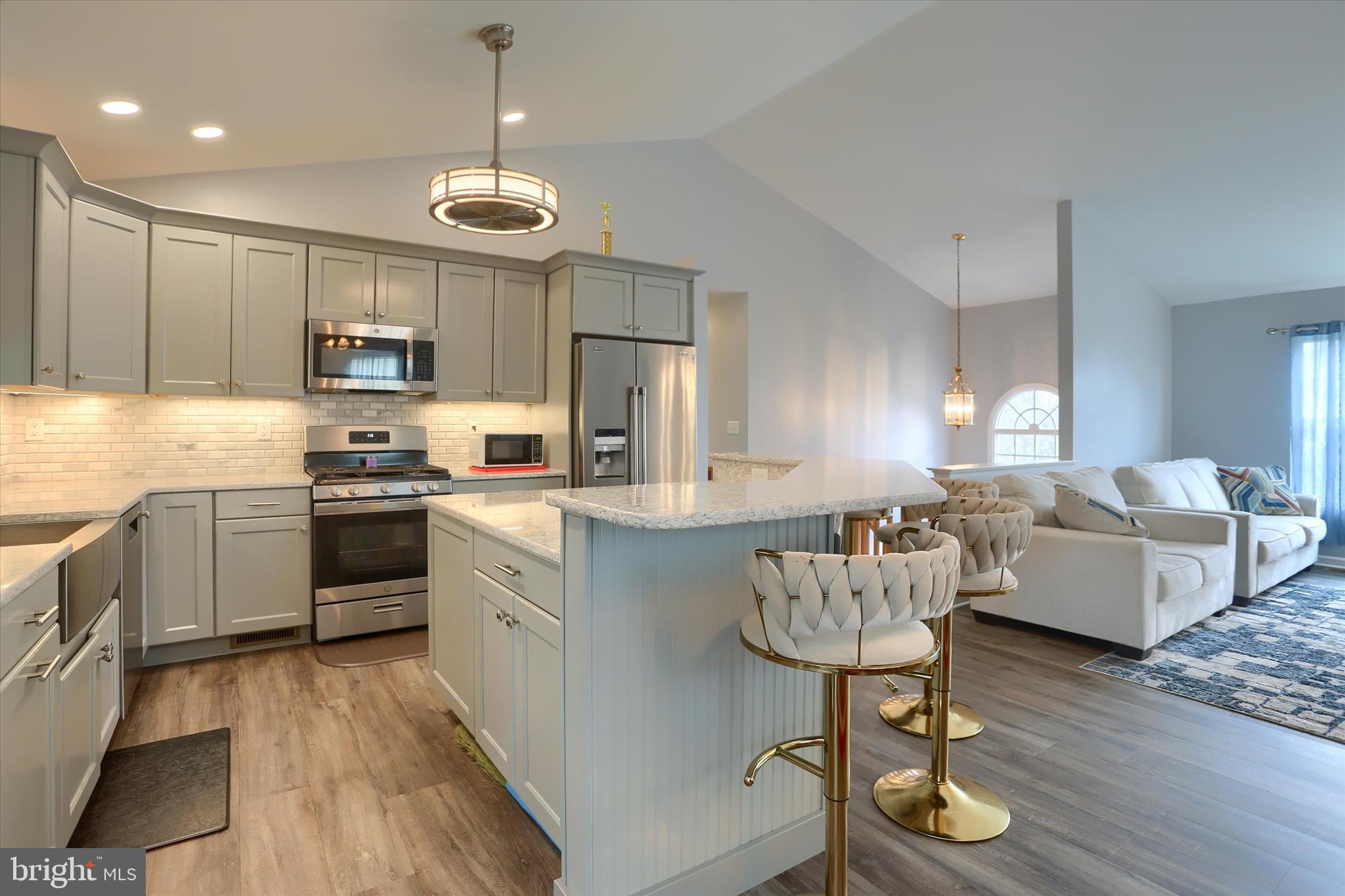 26 Rye Lane Palmyra, PA 17078 - Photo 14 of 52 a kitchen with a chandelier stainless steel appliances cabinets and a counter top space
