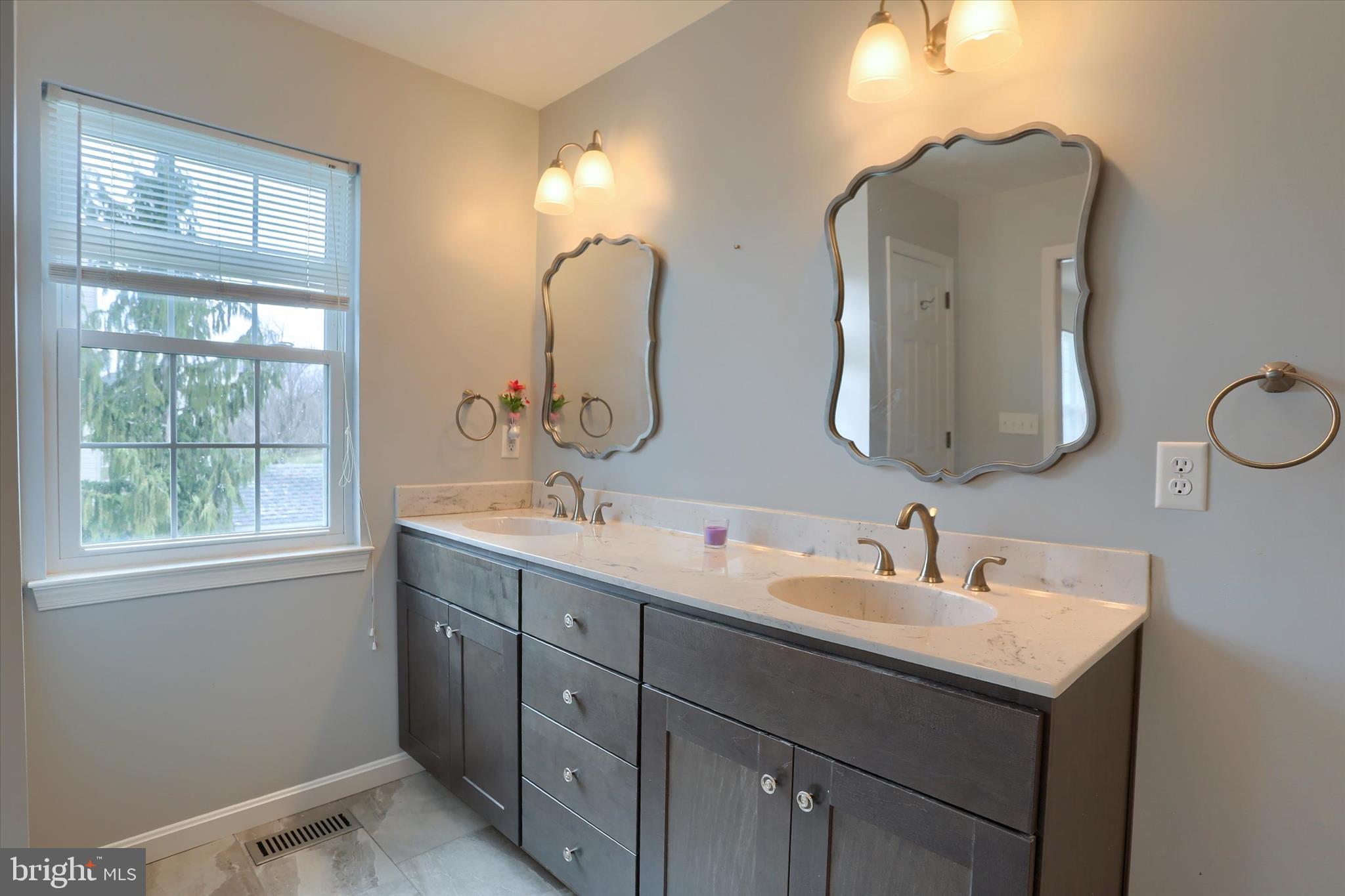 26 Rye Lane Palmyra, PA 17078 - Photo 29 of 52 a bathroom with 2 sink and a mirror