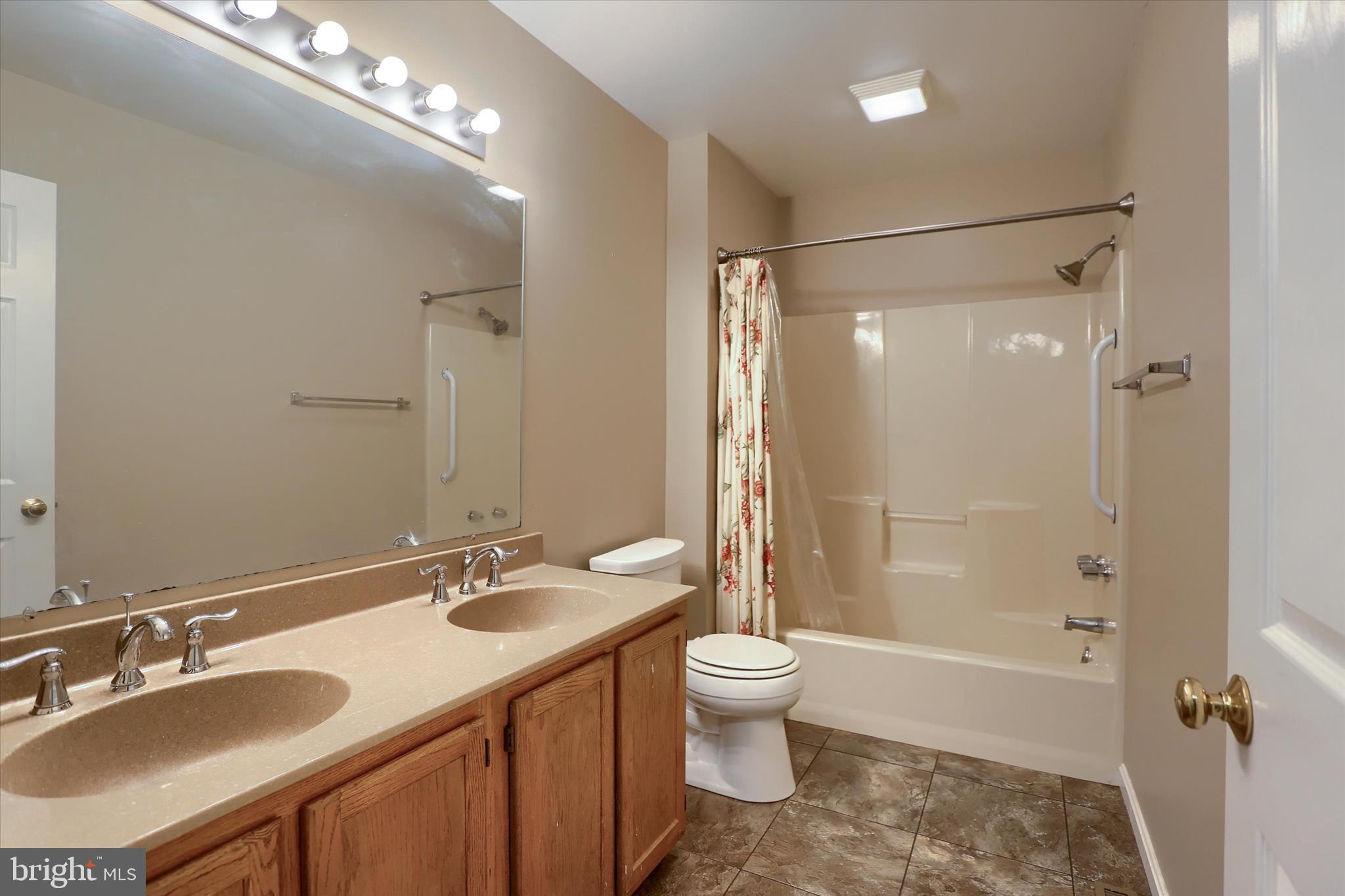 26 Rye Lane Palmyra, PA 17078 - Photo 33 of 52 a bathroom with a double vanity sink toilet mirror and shower