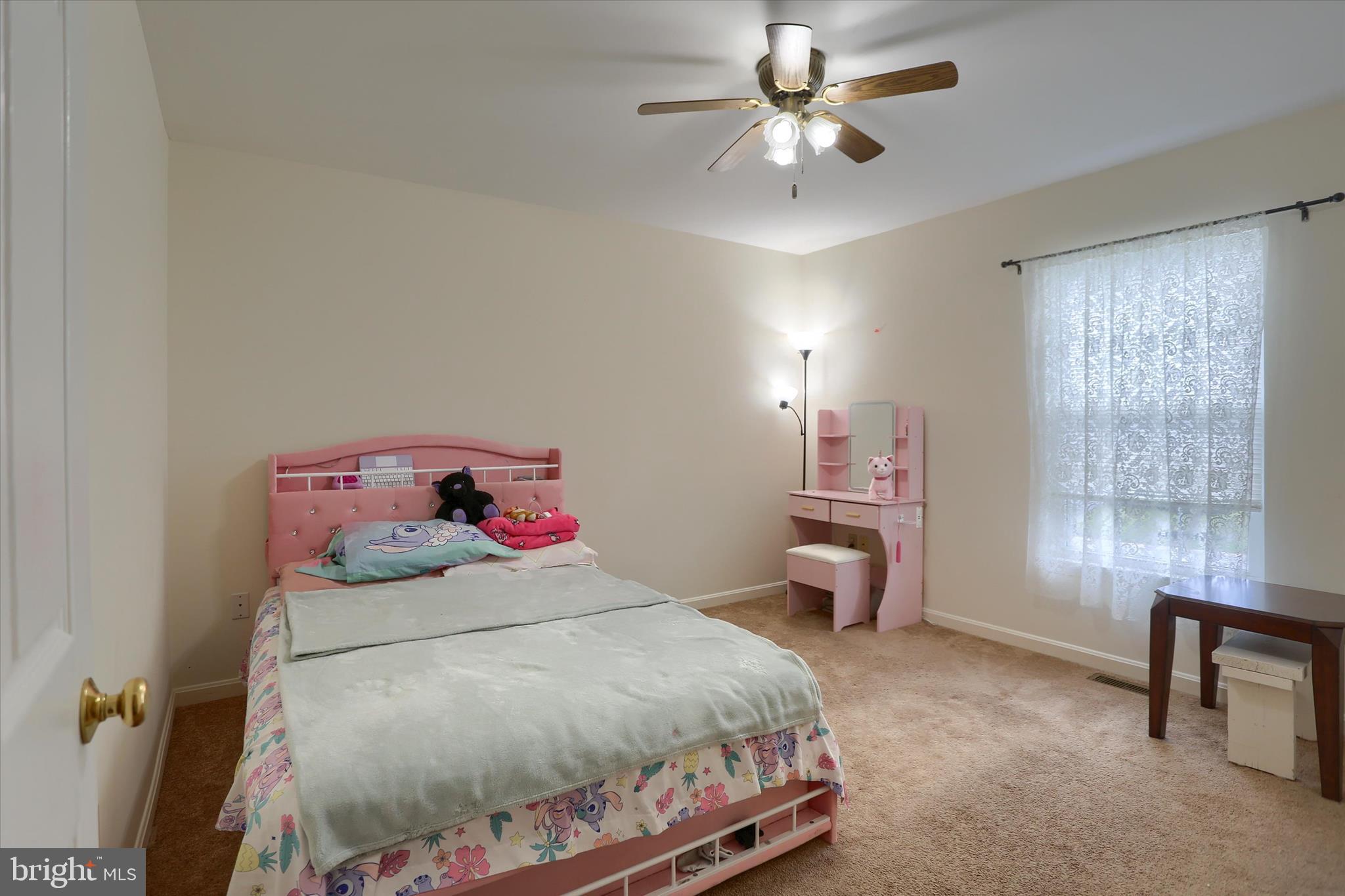 26 Rye Lane Palmyra, PA 17078 - Photo 35 of 52 a bedroom with a bed and a chandelier