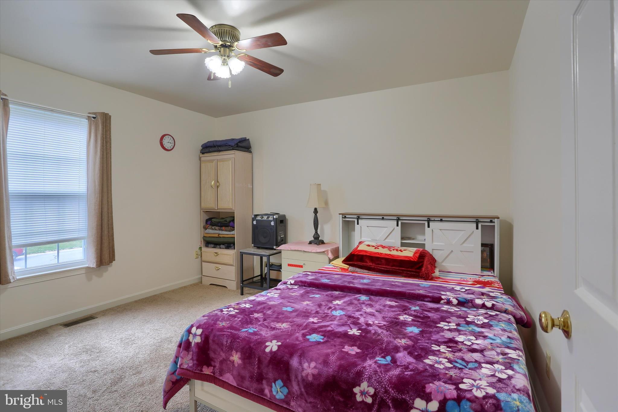 26 Rye Lane Palmyra, PA 17078 - Photo 36 of 52 a bedroom with a bed and a chandelier