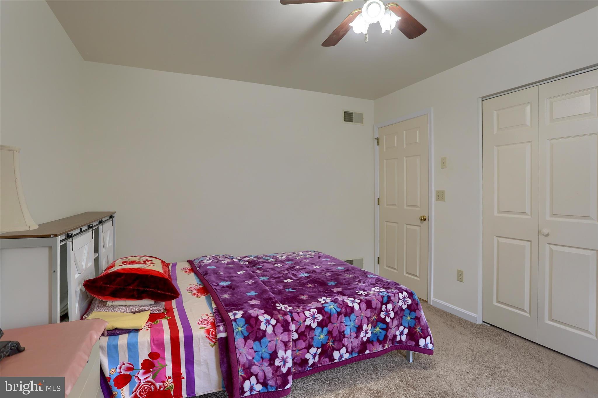 26 Rye Lane Palmyra, PA 17078 - Photo 37 of 52 a bedroom with a bed and a chandelier
