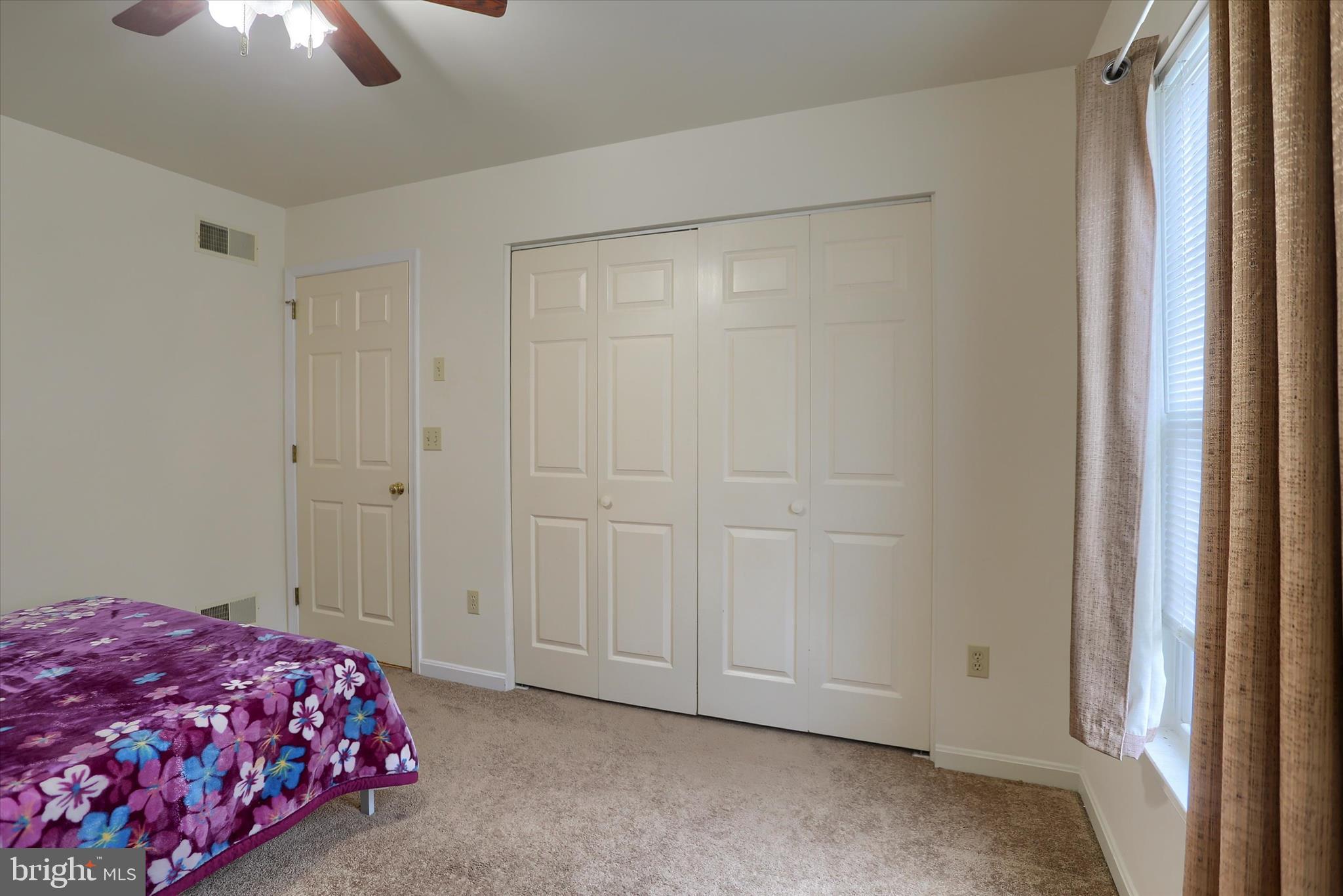 26 Rye Lane Palmyra, PA 17078 - Photo 38 of 52 a bedroom with a bed and a chandelier