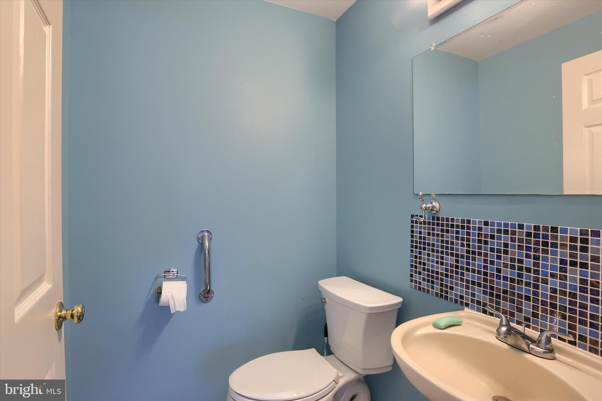 26 Rye Lane Palmyra, PA 17078 - Photo 41 of 52 a white toilet sitting next to a bathroom sink