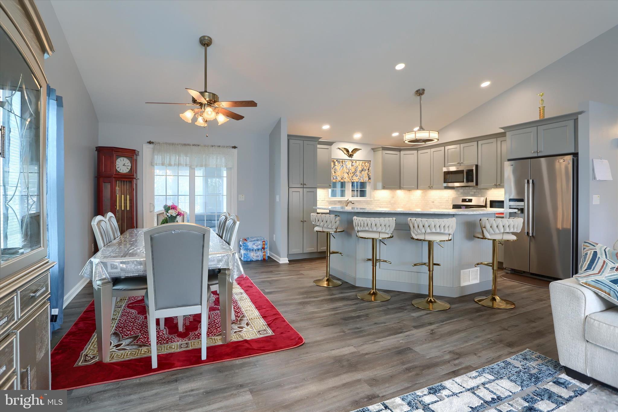 26 Rye Lane Palmyra, PA 17078 - Photo 10 of 52 a living room with kitchen island furniture and a chandelier
