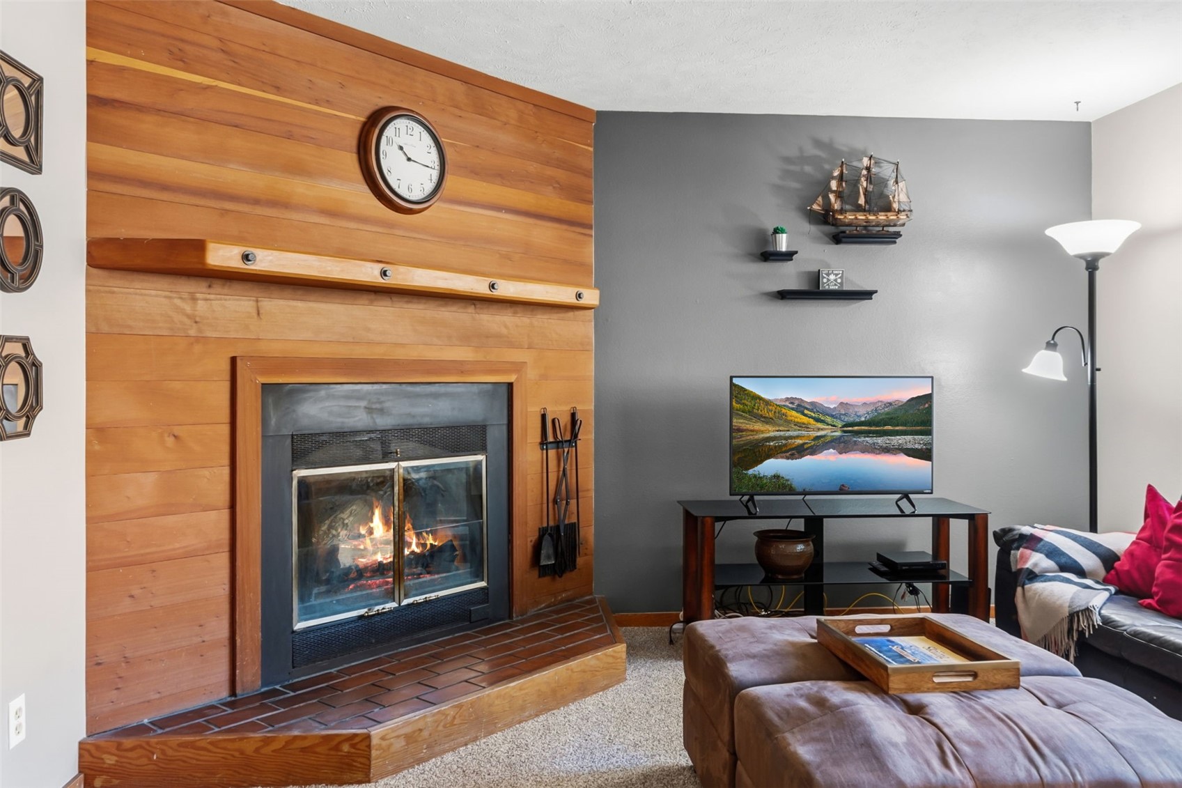 6734 Ryan Gulch Road, Unit 6734 Silverthorne, CO 80498 - Photo 4 of 33 a living room with furniture and a fireplace