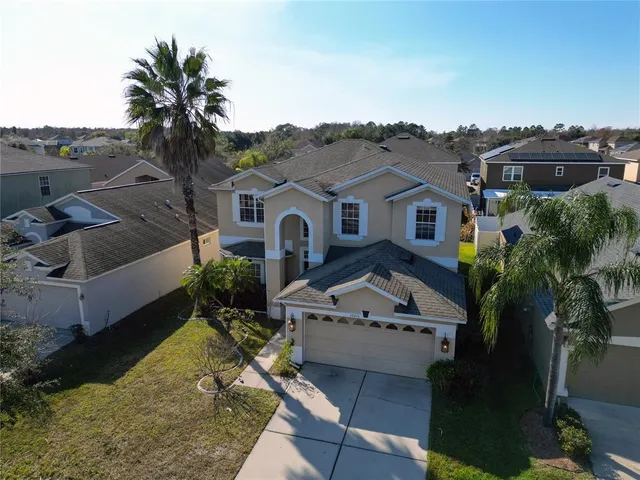a aerial view of a house with a big yard