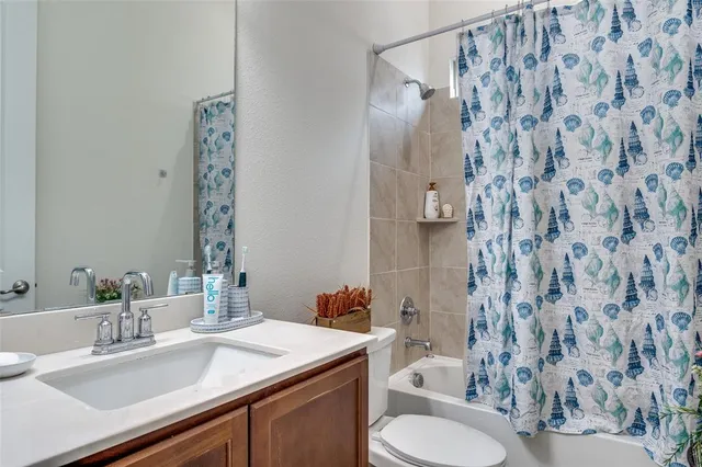 a room with furniture a rug and a window