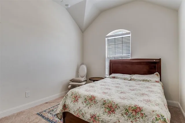 a living room with furniture a ceiling fan and a rug