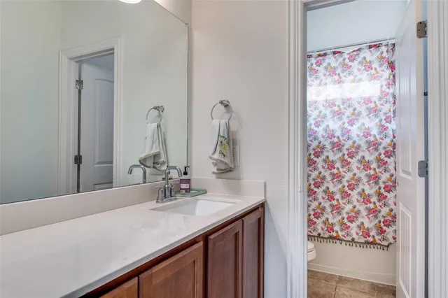 a bedroom with a bed chair and a window