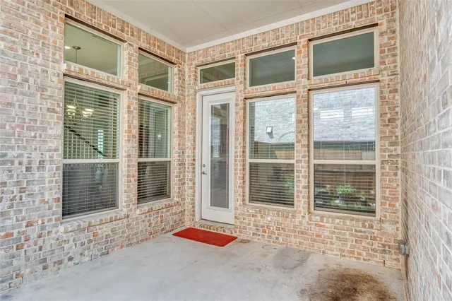 a bedroom with a bed and a desk