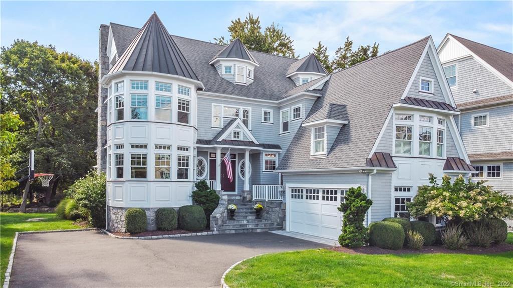 614 Rowland Road Fairfield, CT 06824 - Photo 1 of 1 a front view of a house with a garden