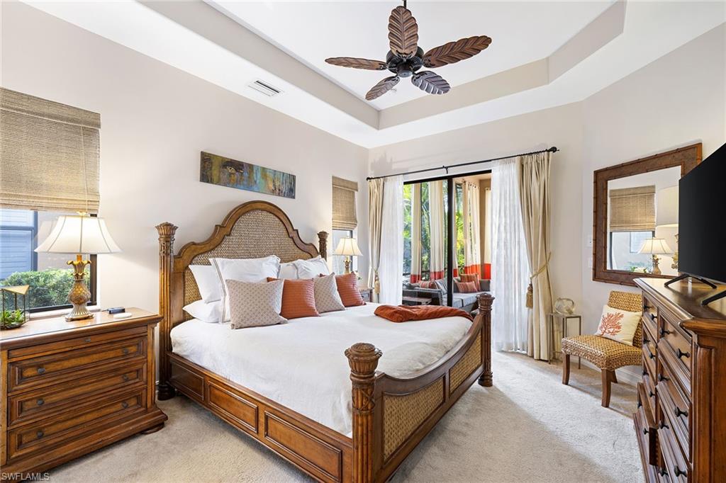 6513 Caldecott Drive Naples, FL 34113 - Photo 22 of 33 a bed room with a bed and a large window