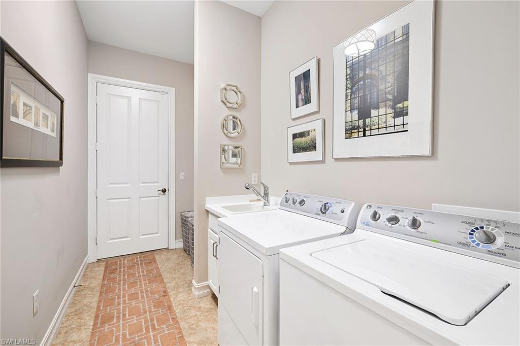 6513 Caldecott Drive Naples, FL 34113 - Photo 31 of 33 a bathroom with a sink and a mirror