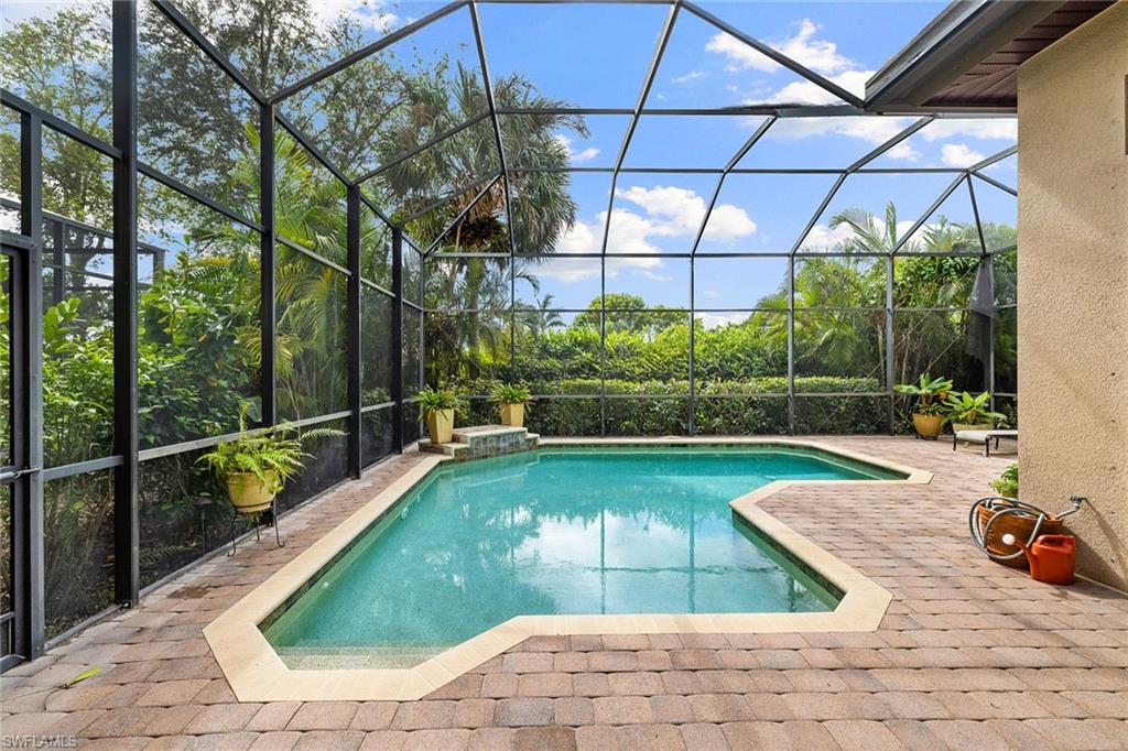 6513 Caldecott Drive Naples, FL 34113 - Photo 32 of 33 a view of a backyard with a patio