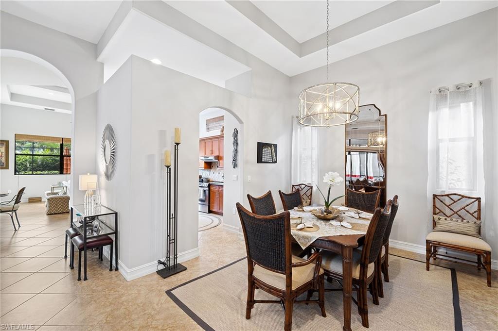 6513 Caldecott Drive Naples, FL 34113 - Photo 10 of 33 a view of a dining room with furniture