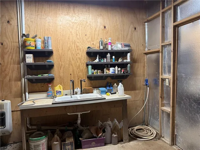 a room with a couch and a bookshelf