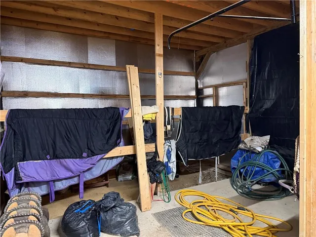 a room with furniture gym equipment and a rug