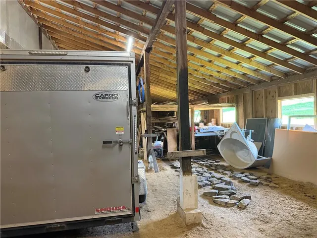 a room with wooden floor and furniture