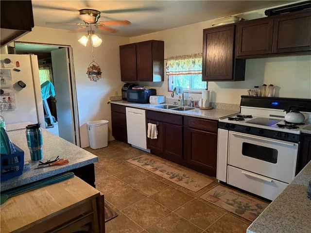 a kitchen with cabinets and appliances