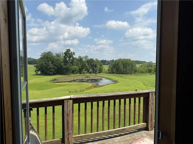 a view of a golf course with a lake