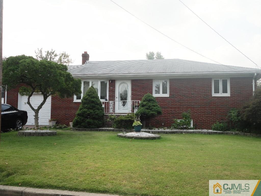 33 Enfield Road Colonia, NJ 07067 - Photo 1 of 9 a front view of house with yard and green space