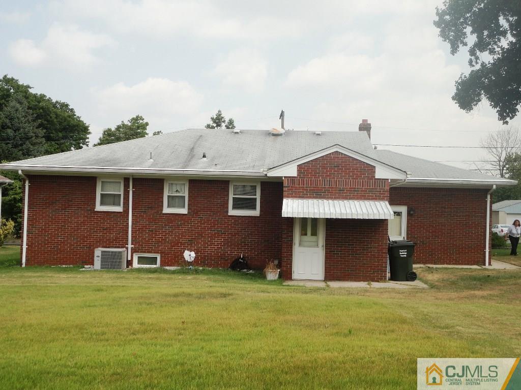 33 Enfield Road Colonia, NJ 07067 - Photo 2 of 9 a front view of a house with garden