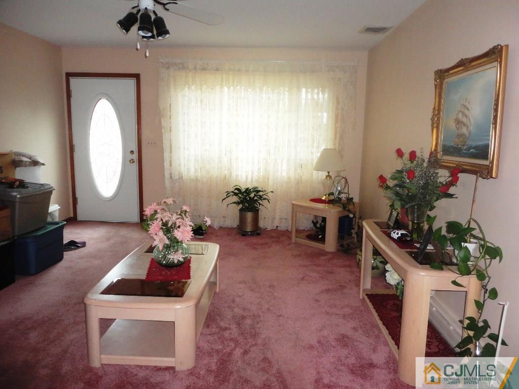 33 Enfield Road Colonia, NJ 07067 - Photo 4 of 9 a room with furniture and flower pot