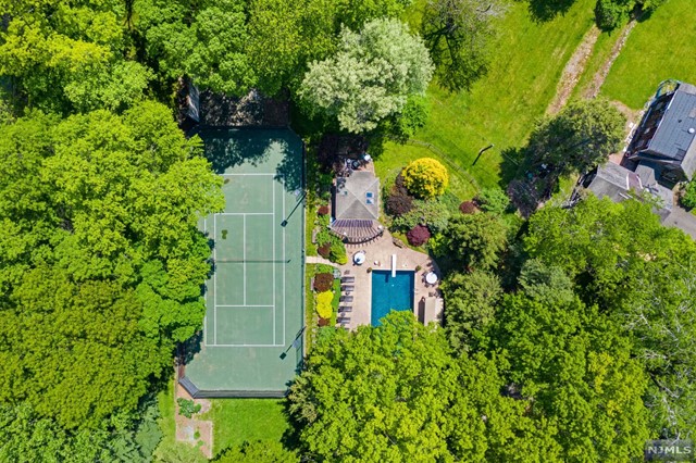 a aerial view of a house with swimming pool and garden space