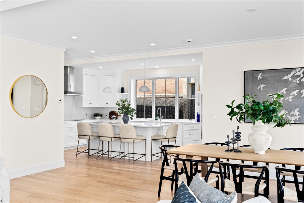 32 Kingsbury Street, Unit A Wellesley, MA 02482 - Photo 3 of 14 a view of a dining room with furniture and wooden floor