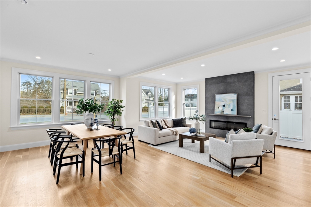 32 Kingsbury Street, Unit A Wellesley, MA 02482 - Photo 5 of 14 a living room with furniture dining table and wooden floor