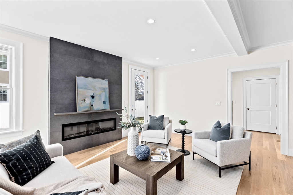 32 Kingsbury Street, Unit A Wellesley, MA 02482 - Photo 6 of 14 a living room with furniture and a wooden floor