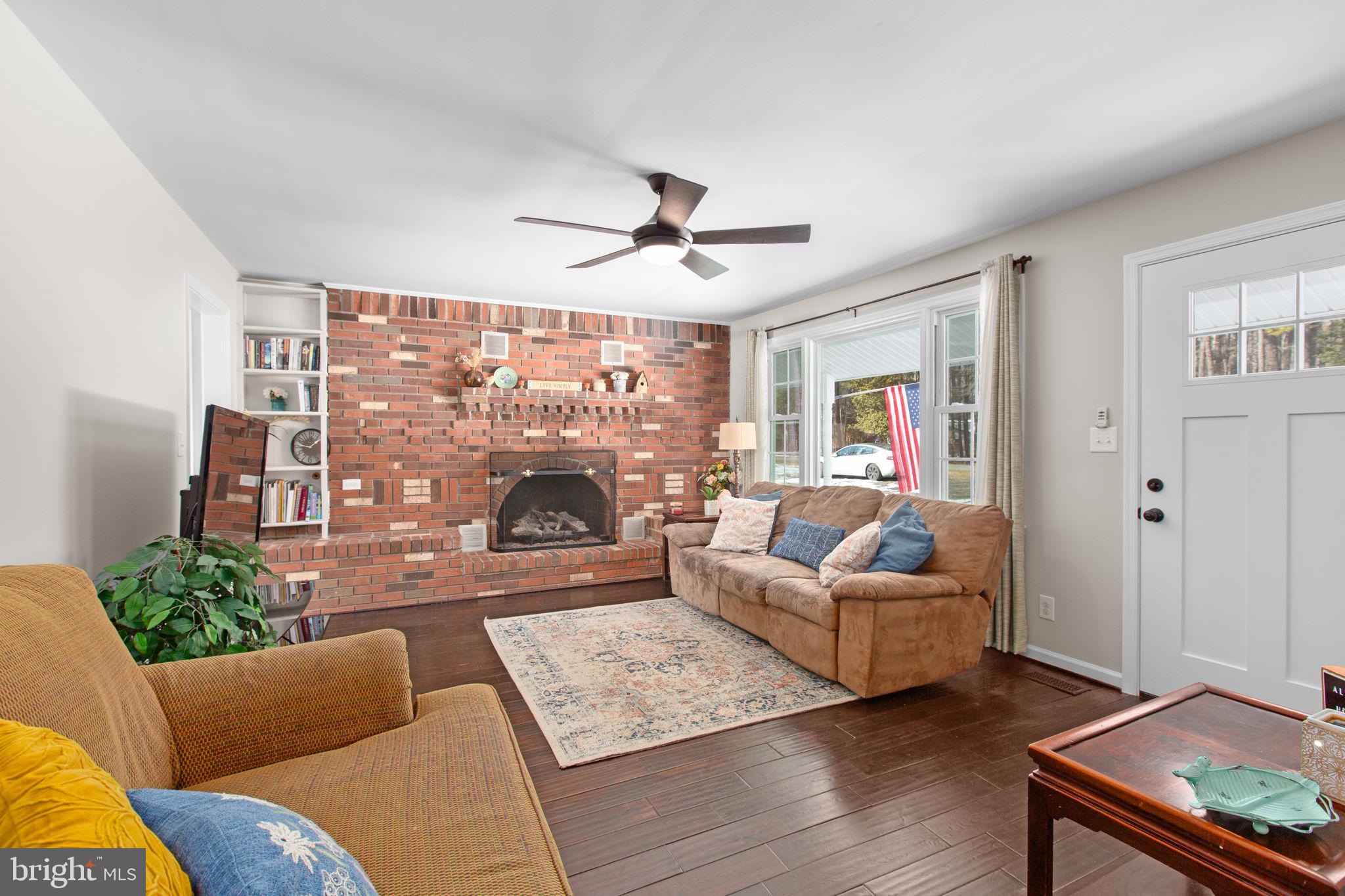 391 Holly Corner Road Fredericksburg, VA 22406 - Photo 8 of 33 Fireplace built into gorgeous exposed brick