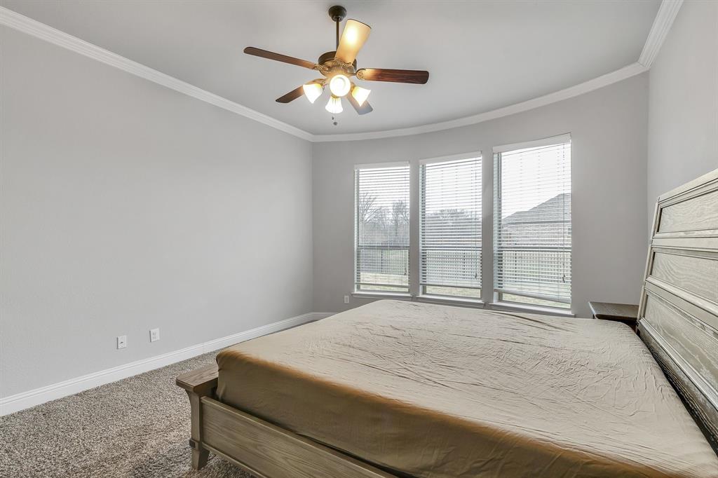 1306 Elizabeth Street Anna, TX 75409 - Photo 12 of 36 a bedroom with a bed and a large window