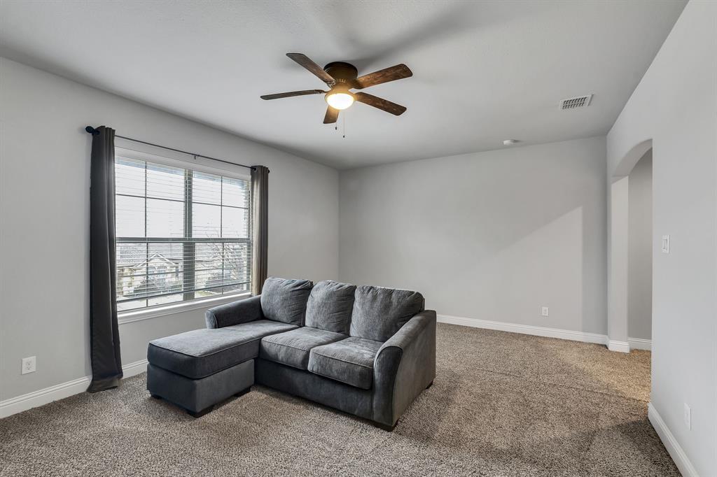 1306 Elizabeth Street Anna, TX 75409 - Photo 17 of 36 a living room with furniture and a window
