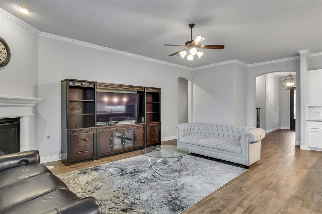 1306 Elizabeth Street Anna, TX 75409 - Photo 22 of 36 a living room with furniture and a flat screen tv