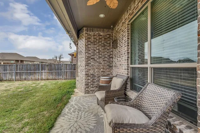 a view of an outdoor sitting area with furniture