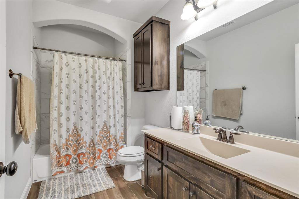 1306 Elizabeth Street Anna, TX 75409 - Photo 36 of 36 a bathroom with a sink toilet and shower