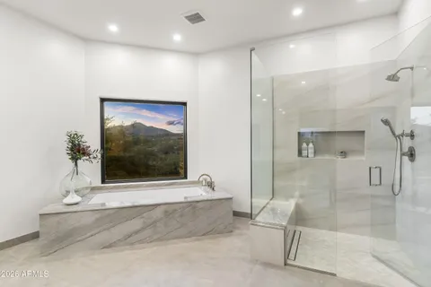 a bathroom with double vanity sinks double vanity and a bathtub