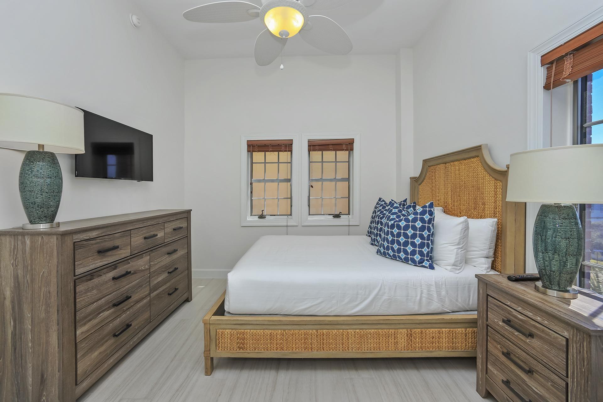 10343 East County 30-a Hwy Inlet Beach, Unit 305 Inlet Beach, FL 32461 - Photo 16 of 19 a bedroom with a bed and flat screen tv