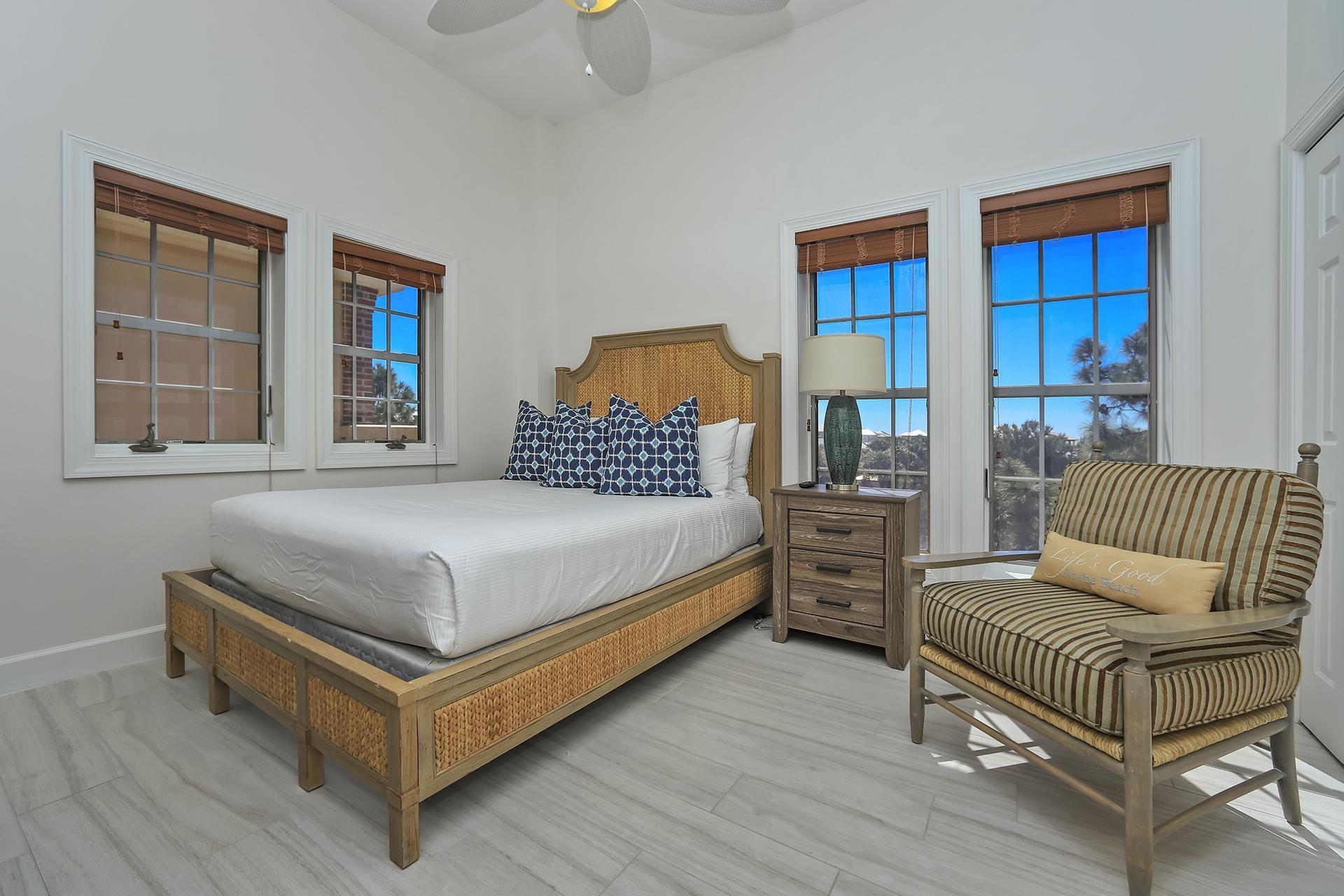 10343 East County 30-a Hwy Inlet Beach, Unit 305 Inlet Beach, FL 32461 - Photo 17 of 19 a bedroom with a bed and wooden floor